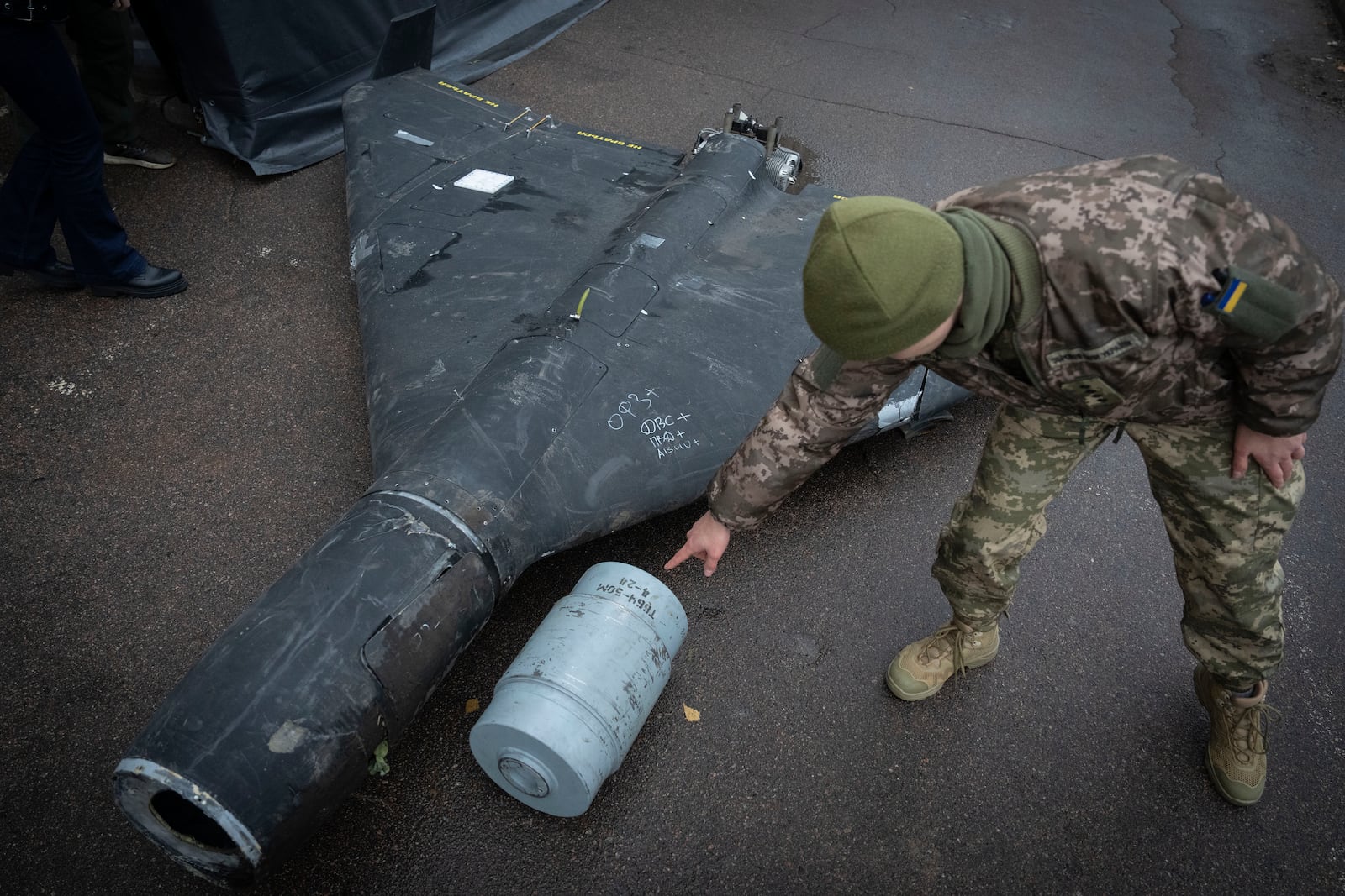 FILE - A Ukrainian officer shows a thermobaric charge from a downed Russian drone in a research laboratory in an undisclosed location in Ukraine on, Nov. 14, 2024. (AP Photo/Efrem Lukatsky, File)