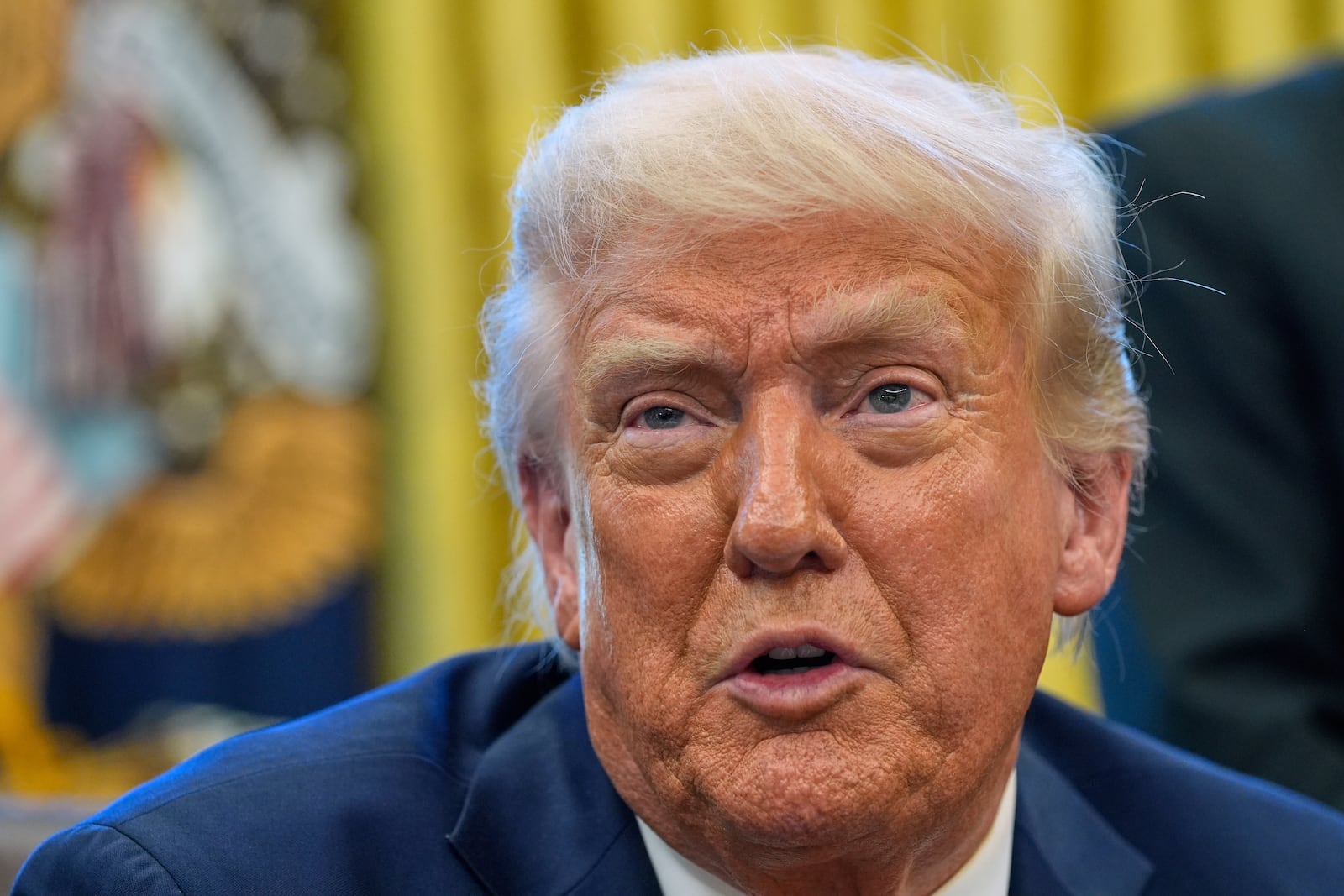President Donald Trump speaks as he signs executive orders in the Oval Office of the White House, Thursday, April 17, 2025, in Washington. (AP Photo/Alex Brandon)