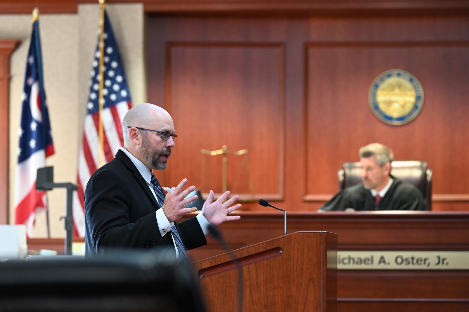 Butler County Assistant Prosecuting Attorney Michael Hon offers opening statements on Wednesday, June 11, 2025, in the Antonio Riano murder trial. Riano is accused of shooting and killing Benjamin Becarra outside the Round House Bar on East Avenue in Hamilton in 2004.  MICHAEL D. PITMAN/STAFF