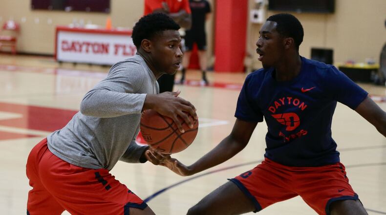 Dayton's Malachi Smith dribbles against Kobe Elvis during a summer practice at the Cronin Center on Monday, Aug. 1, 2022, in Dayton. David Jablonski/Staff