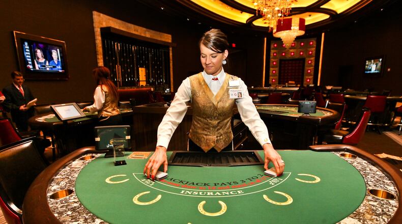 Samantha Wittich practices shuffling cards for the game Pitch inside the High Stakes Room at the Horseshoe Casino in downtown Cincinnati Tuesday, Feb. 26, 2013. The casino will opened it’s doors to the public on March 4. NICK DAGGY / STAFF