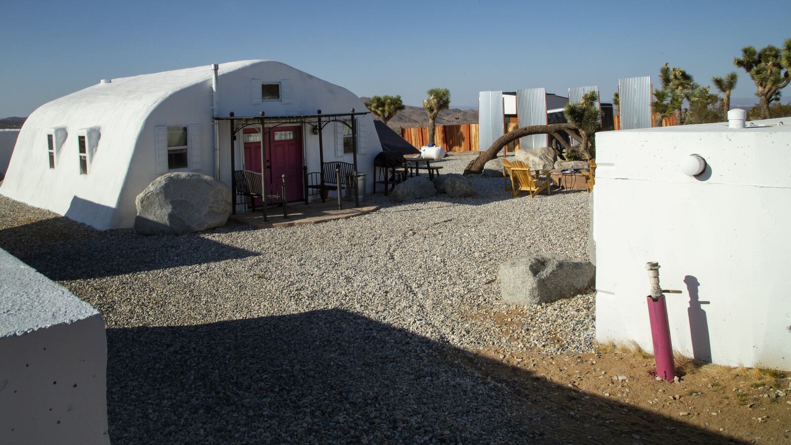 Shipping containers painted bright white, outfitted with showers and wooden floors, is an Airbnb called Moon Camp on May 18, 2018, in Joshua Tree, Calif. Moon Camp is just one of Joshua Tree&apos;s estimated 800 unlicensed vacation rental businesses offering a menu of quirky alternatives to traditional motel lodging: neighborhood homes, vintage trailers, Sherpa huts, tepees, shipping containers, or simply slabs of cement on which to pitch a tent or park a vehicle. (Gina Ferazzi/Los AngelesTimes/TNS)
