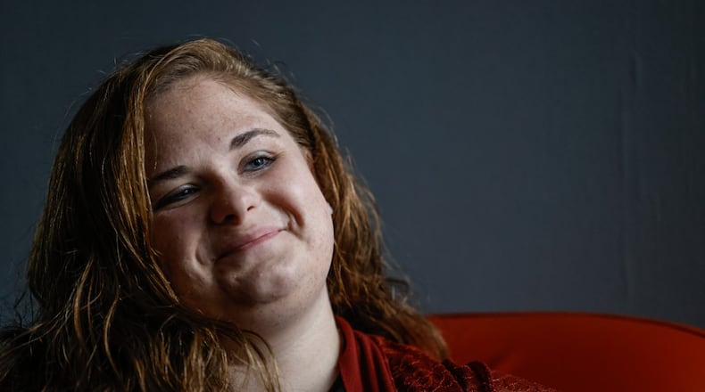 Kaitlyn Olsen is the clinical manager for YWCA in Dayton. Olsen directs care workers who help domestic violence survivors. Care workers and domestic violence survivors both utilize Crisis Now (833-580-2255), a hotline for people in Montgomery County experiencing a mental health crisis. JIM NOELKER/STAFF