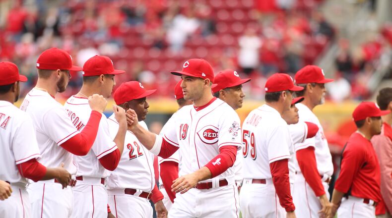 The Reds’ Joey Votto is introduced before a game against the Phillies on Monday, April 3, 2017, at Great American Ball Park in Cincinnati. David Jablonski/Staff
