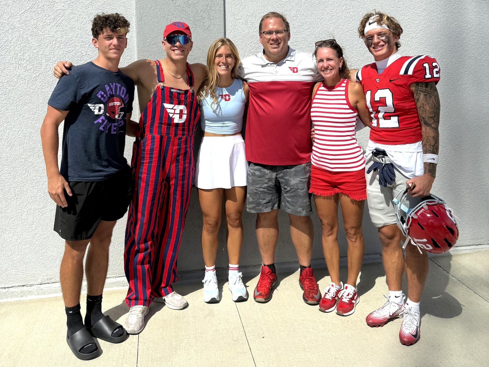 Gavin Lochow met with his family outside the UD dressing room Saturday at Welcome Stadium after the Flyers blanked Thomas More University, 38-0. (Left to right) His brother Trevor; brother Torin; sister Haven; dad Steve; mom Amy; and Gavin. All five family members have shown athletic prowess. Four played in college and Trevor is in his last season at Huntington High. CONTRIBUTED PHOTO