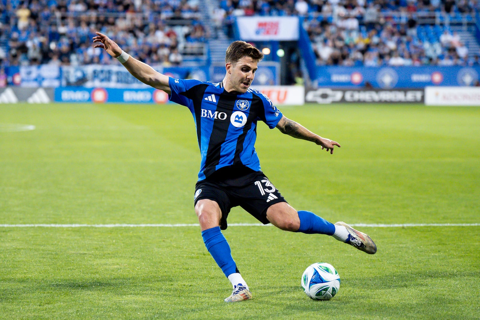 CF Montreal's Luca Petrasso (13) scores during first half MLS soccer action against the Columbus Crew, in Montreal on Wednesday, May 14, 2025. (Christopher Katsarov/The Canadian Press via AP)