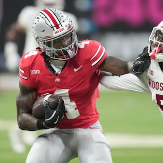 Indiana's D'Angelo Ponds tries to stop Ohio State's Jeremiah Smith during the first half of the Big Ten championship NCAA college football game in Indianapolis, Saturday, Dec. 6, 2025. (AP Photo/AJ Mast)