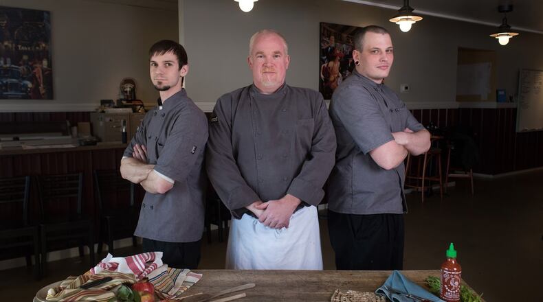 Matthew Hayden, president and CEO at Scratch Food, along with Executive Chef and Director of Operations, Marshall Bartley, have been staying busy during the COVID-19 crisis. They have been steady at work making sure meals get prepared for people who are depending on them. Pictured in the Scratch kitchen from L-R: Travid Day, Executive Chef Marshall Bartley and Aaron Carberry.