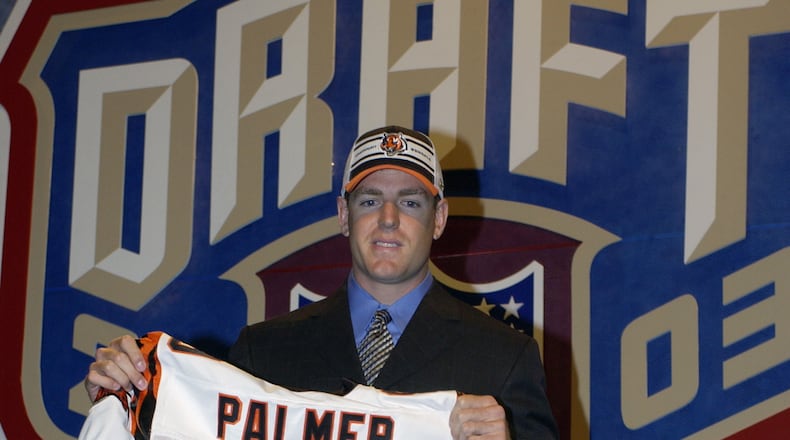 Carson Palmer from USC after being selected first by the Cincinnati Bengals at the 2003 NFL Draft on April 26, 2003 at Madison Square Garden in New York City. Palmer agreed to a $40 million/seven year deal on April 24 that includes a $10 million signing bonus, with another $4 million bonus due in two years. He will make $18.25 million in the first three years through bonuses and salary. (Photo by Ezra Shaw/Getty Images)