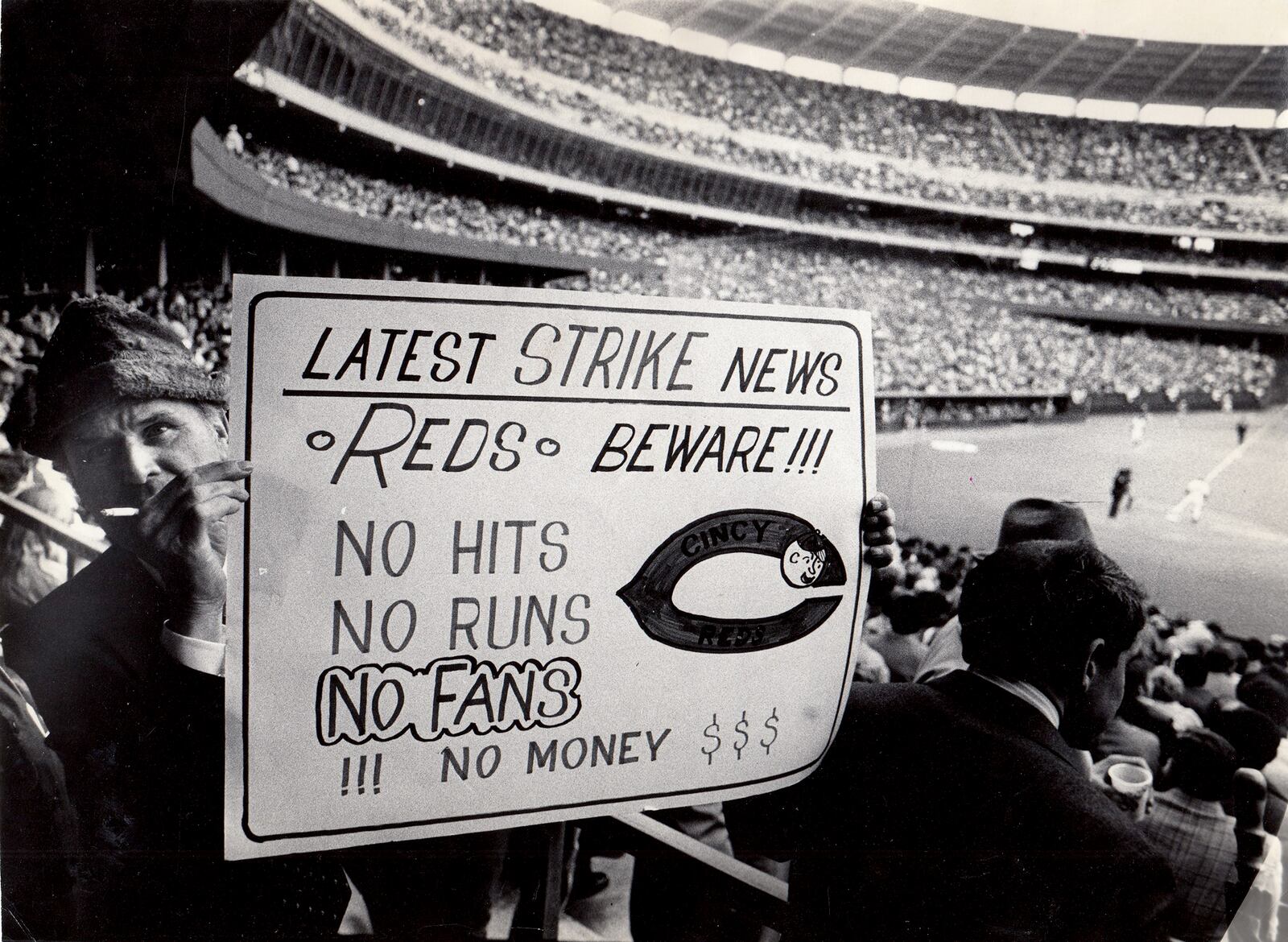 A baseball fan makes his opinion know during the opening day game of the Cincinnati Reds in 1980. DAYTON DAILY NEWS ARCHIVE