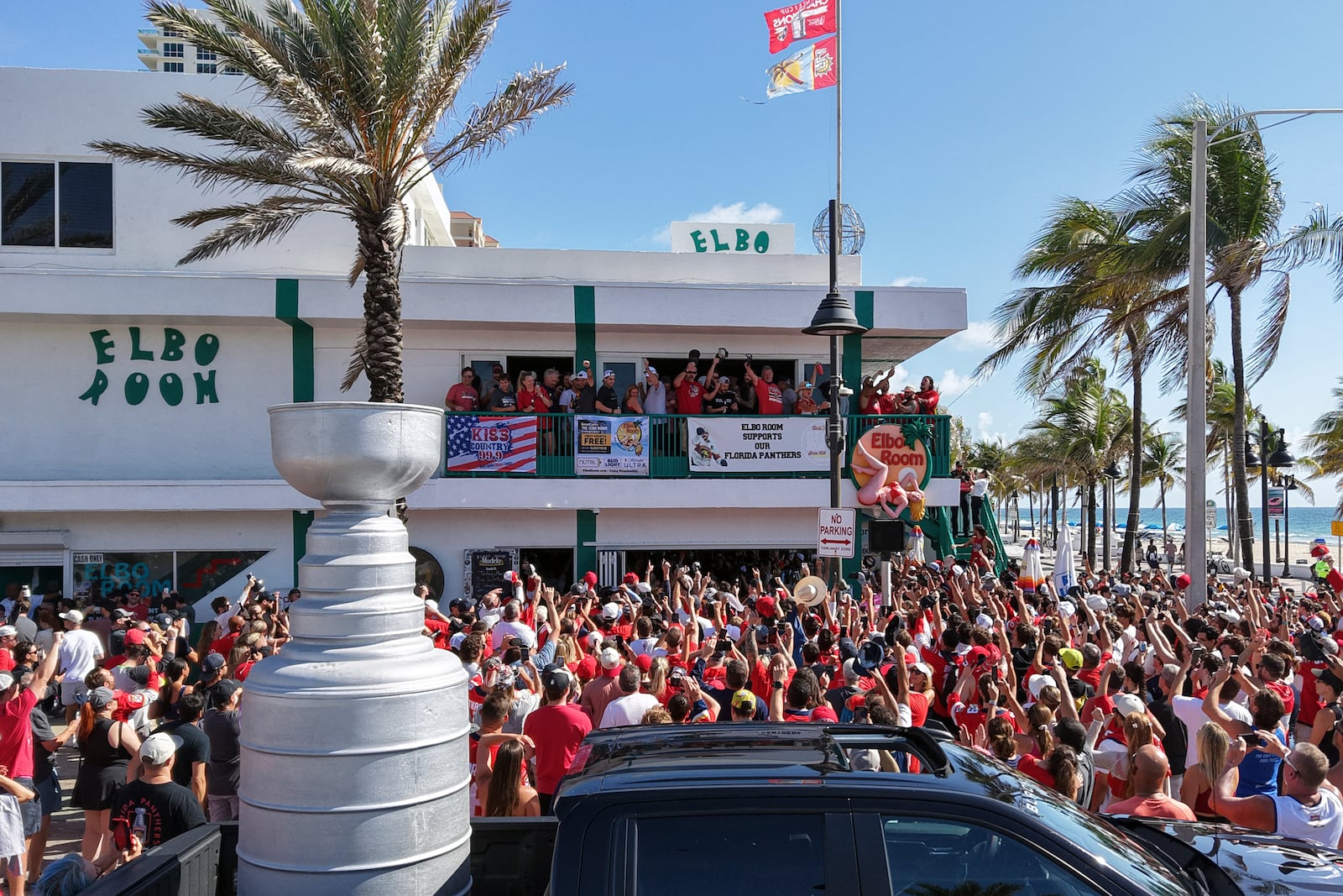 Members of the Florida Panthers hockey team celebrate with fans outside the Elbo Room, Wednesday, June 18, 2025, in Fort Lauderdale, Fla., the morning after defeating Edmonton in Game 6 of the Stanley Cup Final. (Amy Beth Bennett/South Florida Sun-Sentinel via AP)