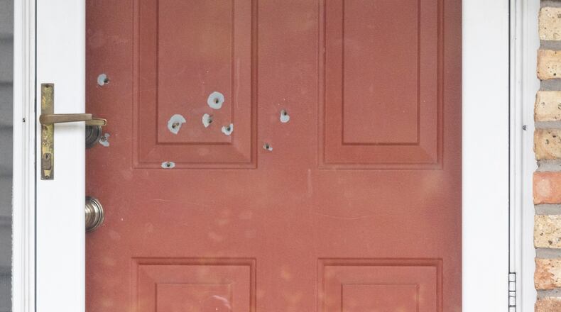 Bullet holes in the door of State Sen. John Hoffman’s home in Chaplin, Minn., on Saturday, June 14, 2025. A man suspected of assassinating a Minnesota lawmaker on Saturday and of shooting another was identified by the authorities as Vance Boelter, 57. (Tim Gruber/The New York Times)