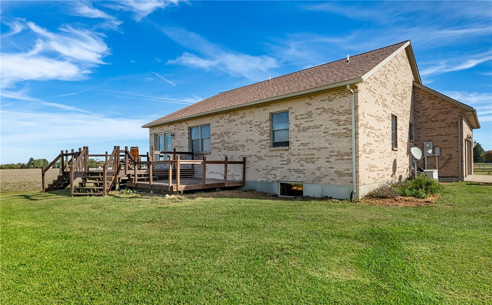 The back of the home has a two level wood deck with steps leading down to the back yard and overlooking the property beyond. CONTRIBUTED