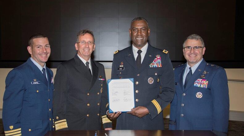 Following a “Laboratory Commanders Sync” meeting Oct. 28, leaders from Department of Defense and Department of Homeland Security service laboratories signed a memorandum of understanding for an expanded working relationship marked by cooperation and collaboration in a broad range of activities, especially in areas of mutual benefit. Left to right: Capt. Gregory Rothrock from the U.S. Coast Guard Research and Development Center; Rear Adm. David Hahn, chief of the Office of Naval Research; Maj. Gen Cedric Wins, commanding general, Army Combat Capabilities Development Command and Maj. Gen. William Cooley, Air Force Research Laboratory commander. (U.S. Air Force photo/Airman 1st Class Spencer Slocum)