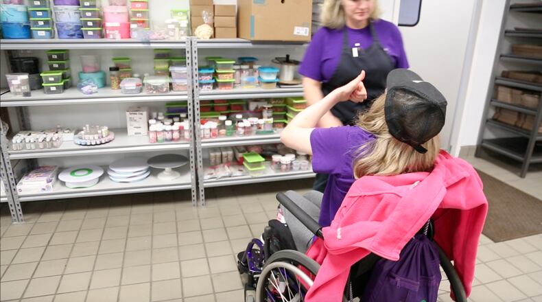 Brittany gives a thumbs up to bakery owner Tempa Kohler.