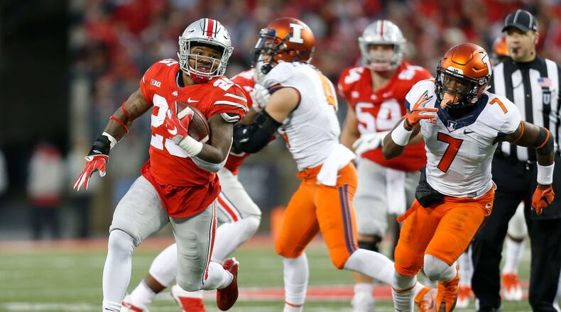 COLUMBUS, OH - NOVEMBER 18: Mike Weber #25 of the Ohio State Buckeyes runs past Stanley Green #7 of the Illinois Fighting Illini for a 43 yard touchdown run during the first quarter on November 18, 2017 at Ohio Stadium in Columbus, Ohio. Ohio State defeated Illinois 52-14. (Photo by Kirk Irwin/Getty Images)
