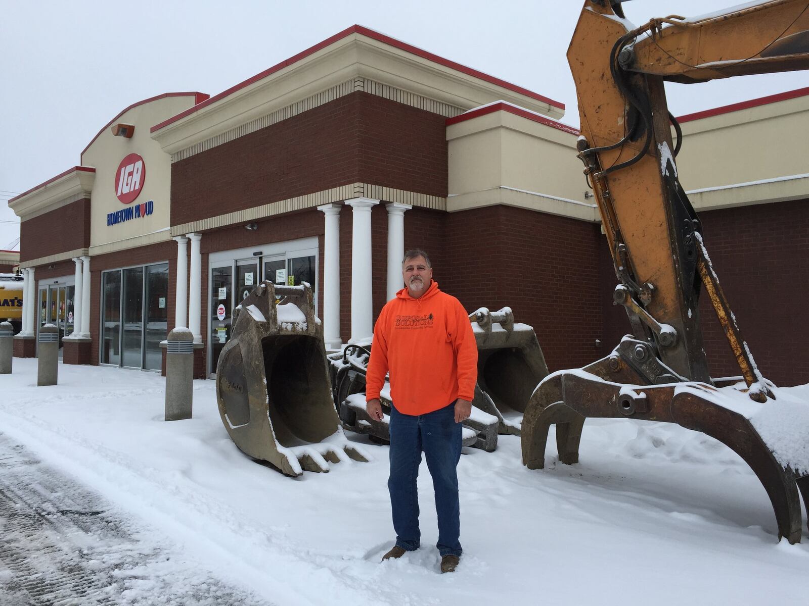 Tim Hackney, owner of Disposal Solutions, was preparing the former Springboro IGA for demolition on Monday. Work is expected to begin Tuesday, or as soon as Hackney is sure all utilities have been disconnected. PHOTO BY LAWRENCE BUDD