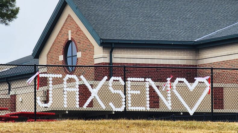 Memorial outside of Madison Local Sc schools remembering Jaxsen Elkins who was killed in an accident Thursday night in the driveway of his home. NICK GRAHAM/STAFF