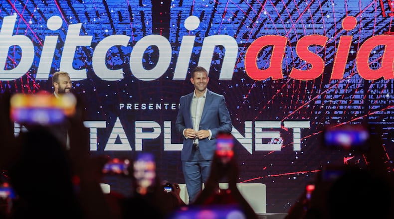 FILE - Eric Trump, Executive Vice President of the Trump Organization reacts during the Bitcoin Asia 2025, at the Hong Kong Exhibition Centre in Hong Kong, on Aug. 29, 2025. (AP Photo/Daniel Ceng, File)