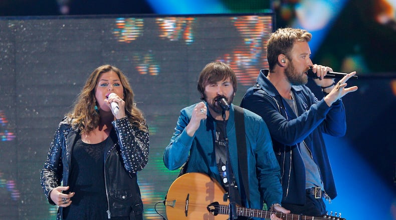 Hillary Scott, from left, Dave Haywood and Charles Kelley, of Lady Antebellum, perform at the CMT Music Awards at Bridgestone Arena on Wednesday, June 10, 2015, in Nashville, Tenn. (Photo by Wade Payne/Invision/AP)