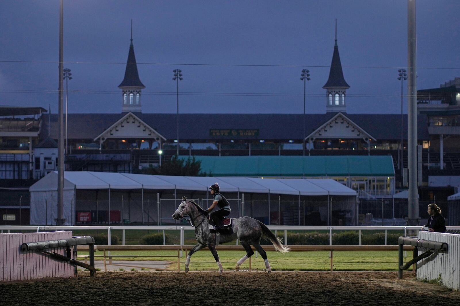 A race horse works out at Churchill Downs Wednesday, April 30, 2025, in Louisville, Ky. (AP Photo/Charlie Riedel)