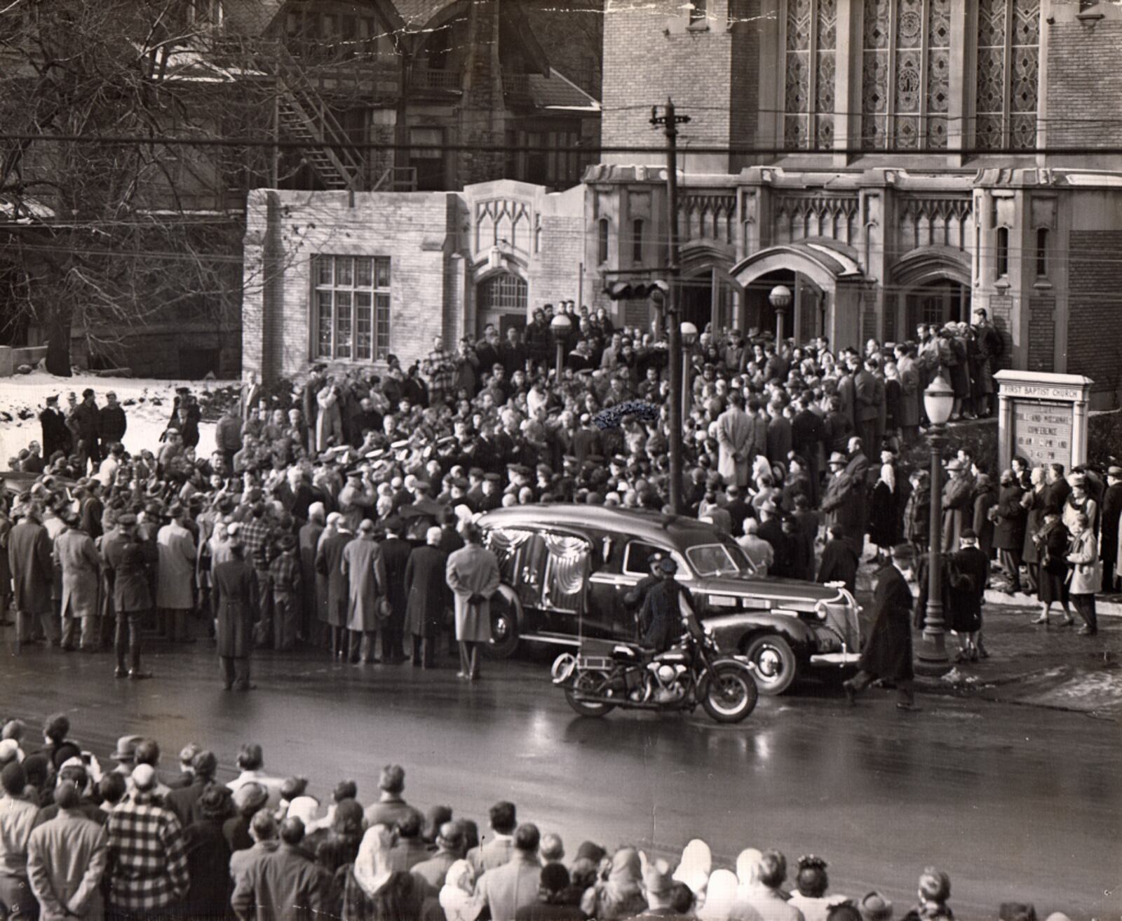 More than 1000 persons lined both sides of Monument Ave. near the First Baptist Church as Orville Wright's casket was removed from church following completion of funeral services. More than 850 persons crowded into the church to hear the final eulogy delivered by Dr. Charles L. Seasholes. DAYTON DAILY NEWS ARCHIVE