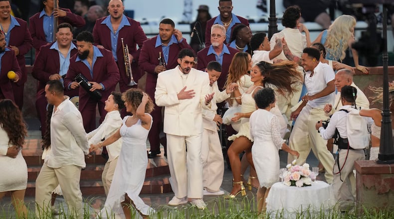 Bad Bunny performs in his white suit by the fast-fashion retailer Zara during the halftime show of Super Bowl LX at Levi’s Stadium in Santa Clara, Calif., Feb. 8, 2026. The Puerto Rican superstar’s set included cameos, stunts and powerful statements. (Loren Elliott/The New York Times)