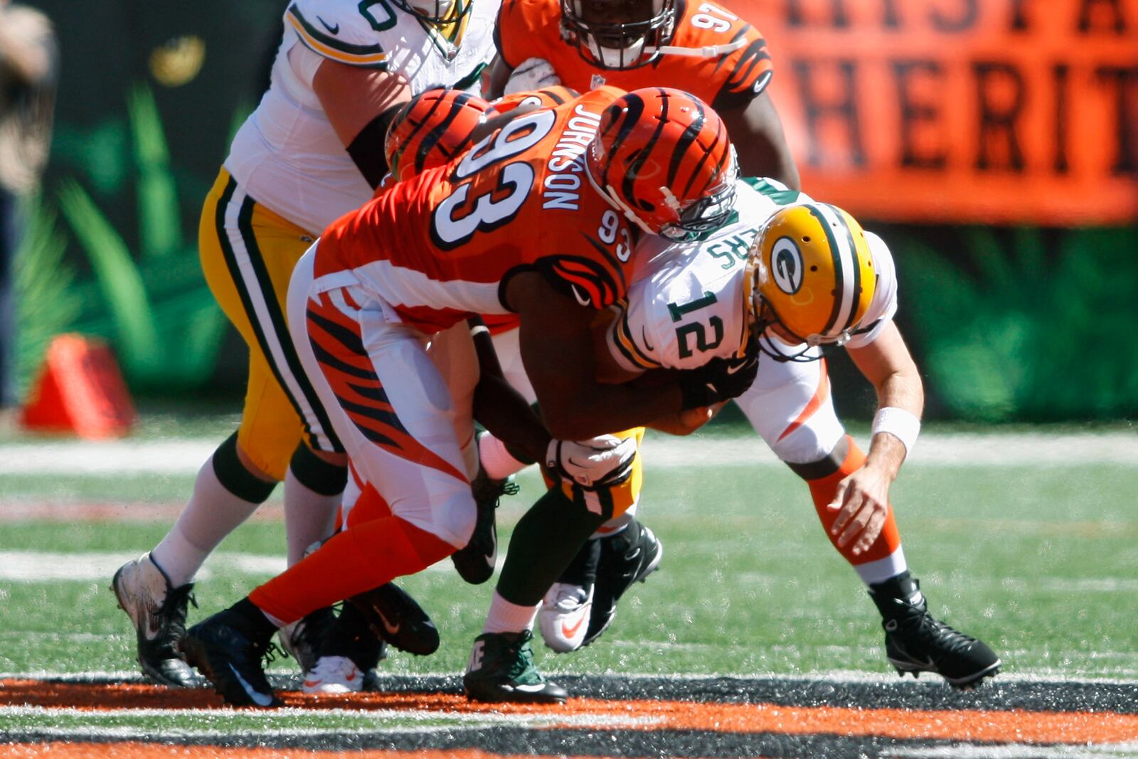 CINCINNATI, OH - SEPTEMBER 22: Michael Johnson #93 of the Cincinnati Bengals sacks Aaron Rodgers #12 of the Green Bay Packers during their game at Paul Brown Stadium on September 22, 2013 in Cincinnati, Ohio. The Bengals defeated the Packers 34-30. (Photo by John Grieshop/Getty Images)
