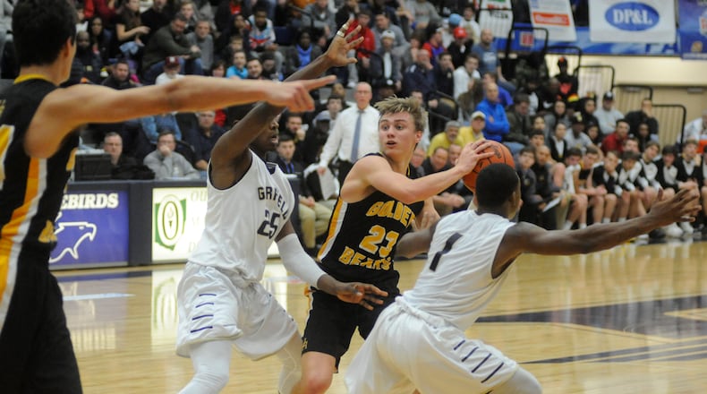 Dane Goodwin of Upper Arlington (with ball) is verbally committed to Ohio State University. He scored 34 points in a 62-34 defeat of Garfield Heights in Day 3 of the Premier Health Flyin’ to the Hoop at Trent Arena in Kettering on Sunday, Jan. 15, 2017. MARC PENDLETON / STAFF