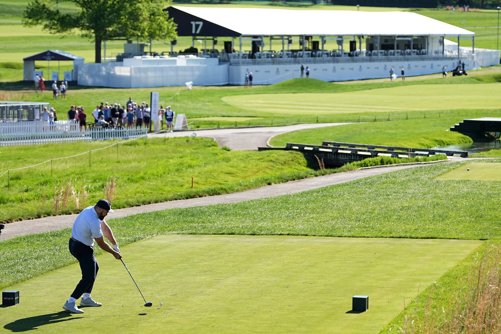 Former Philadelphia Eagles football player Jason Kelce hits on the 17th hole during a pro-am before the Truist Championship golf tournament at the Philadelphia Cricket Club, Wednesday, May 7, 2025, in Flourtown, Pa. (AP Photo/Matt Rourke)