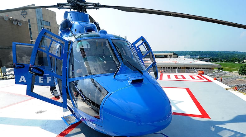 A CareFlight pilot prepares for takeoff off the south pad atop Miami Valley Hospital on Wednesday, July 5, 2023. MARSHALL GORBY\STAFF