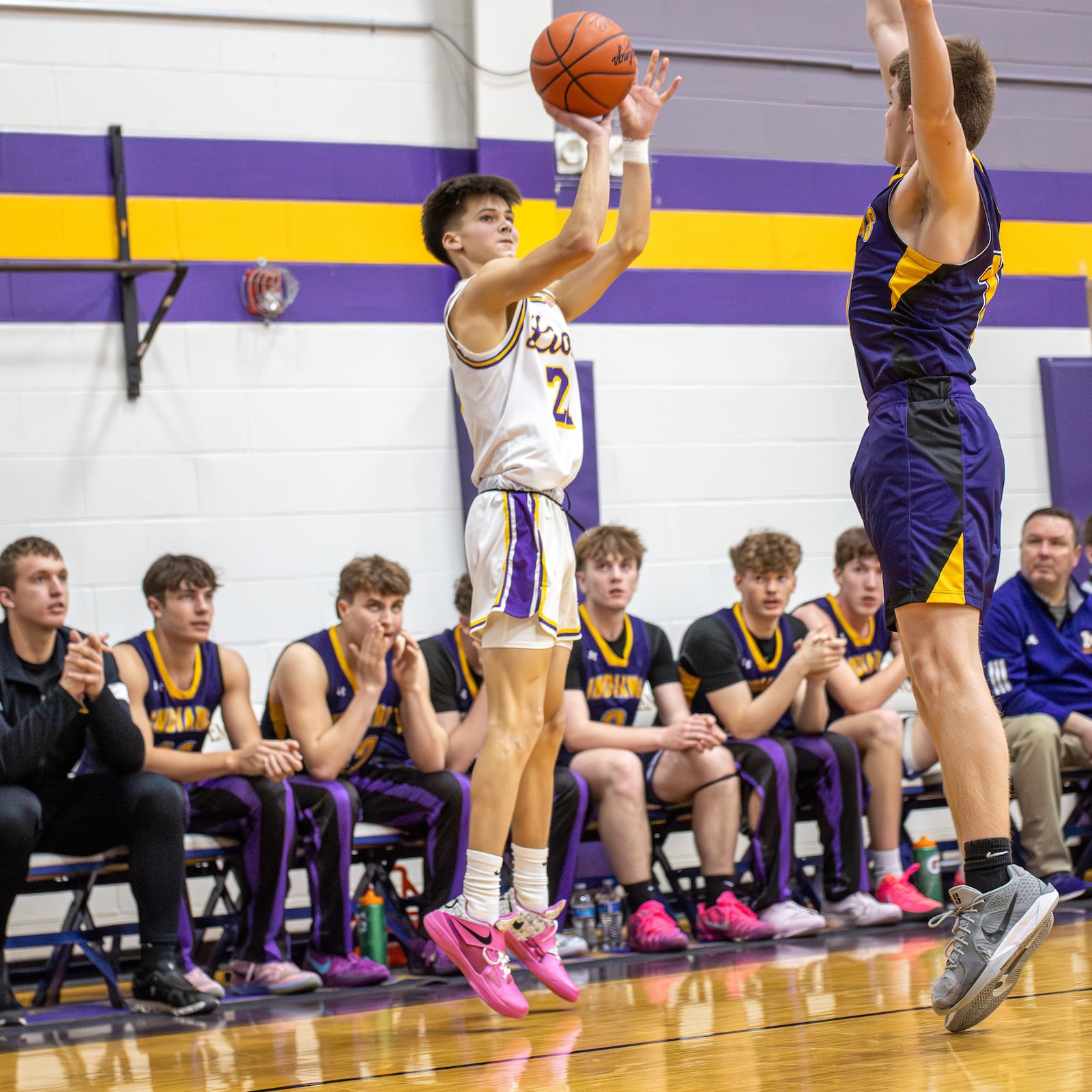 Emmanuel Christian junior Josh Witherow shoots the ball over Mechanicsburg sophomore Matthew Davis during their game on Tuesday, Feb. 17, 2026 in Springfield. The Lions won 70-60. MICHAEL COOPER / STAFF