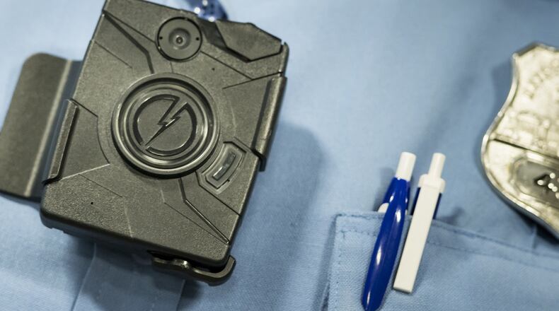 As more police departments use body cameras, it raises concerns about transparency, accountability and privacy. (Photo credit should read BRENDAN SMIALOWSKI/AFP/Getty Images)