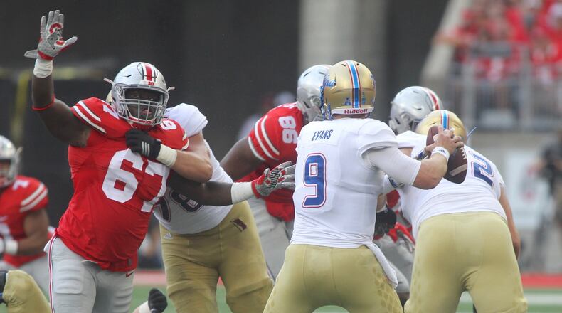 Ohio State’s Robert Landers pressures Tulsa quarterback Dane Evans on Saturday, Sept. 10, 2016, at Ohio Stadium in Columbus. David Jablonski/Staff