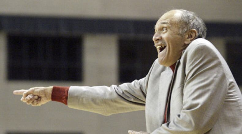 RedHawks Head Coach Charlie Coles encourages his team during first-half action against Wright State on Monday, Nov. 24, at Wright State's Nutter Center.