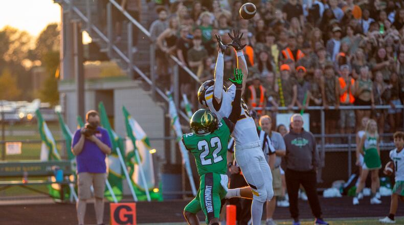 Centerville's Ryan Keifer reaches for a 4-yard touchdown catch from Chase Harrison over Northmont's Melvin Howard for the Elks' second score Friday night at Northmont. Jeff Gilbert/CONTRIBUTED