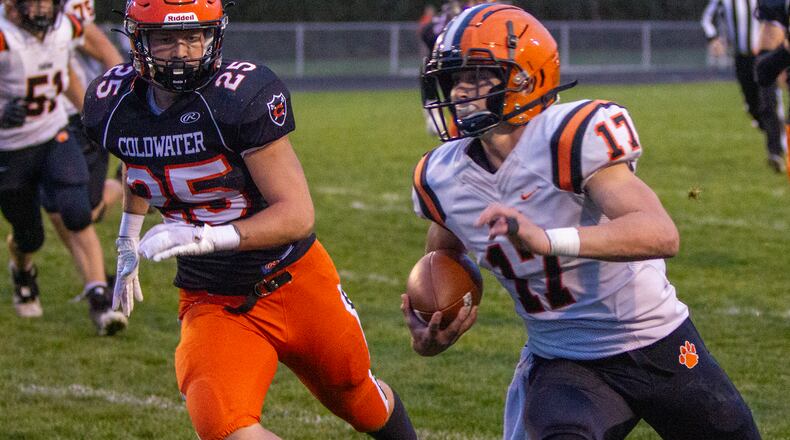 Versailles quarterback Michael Osborne runs against Coldwater earlier this season. On Friday, Versailles advanced to the state semifinals. FILE PHOTO