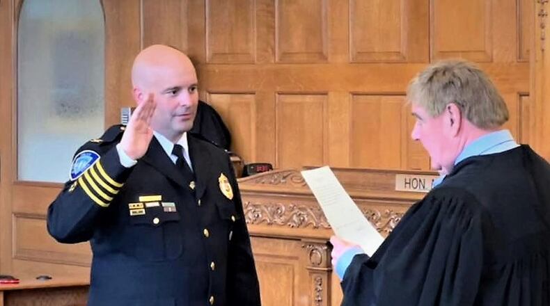 Xenia Police Chief Chris Stutes is sworn in at the Greene County courthouse by Judge Mike Buckwalter, June 10. CONTRIBUTED