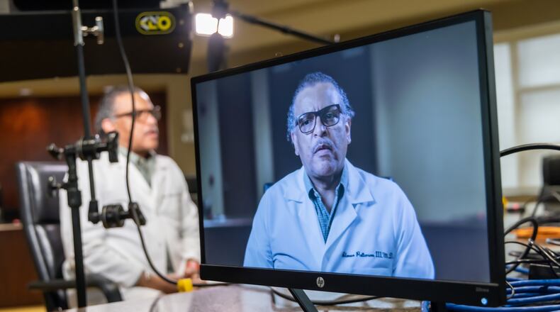Dr. Alonzo Patterson III, a member of the Gem City Medical Dental Pharmaceutical Society, participates in a video public service announcement discussing the importance of getting the COVID-19 vaccine.  WILL JONES/PREMIER HEALTH