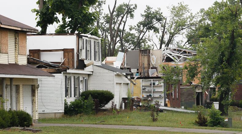 Three months after the Memorial Day tornadoes, little progress has been made on some houses like those in Trotwood on Greenbrook Drive seen Tuesday, Aug. 27, 2019. CHRIS STEWART / STAFF