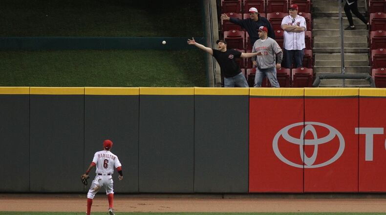 Reds center fielder Billy Hamilton watches as a ball hit by the Indians’ Francisco Lindor lands behind the fence in center field in the 12th inning on Thursday at Great American Ball Park. David Jablonski/Staff