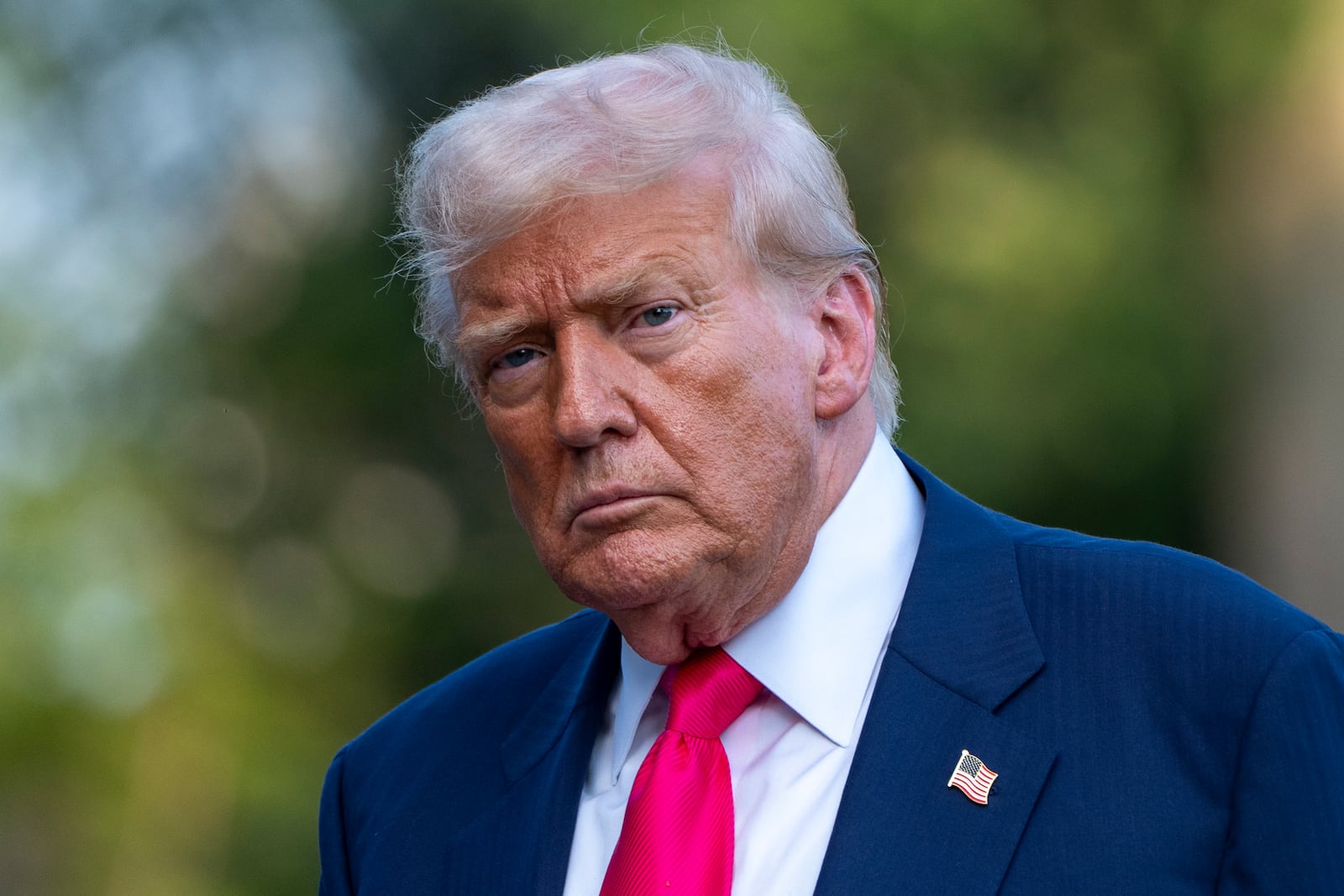 President Donald Trump walks from Marine One after arriving on the South Lawn of the White House, Tuesday, July 15, 2025, in Washington. (AP Photo/Alex Brandon)