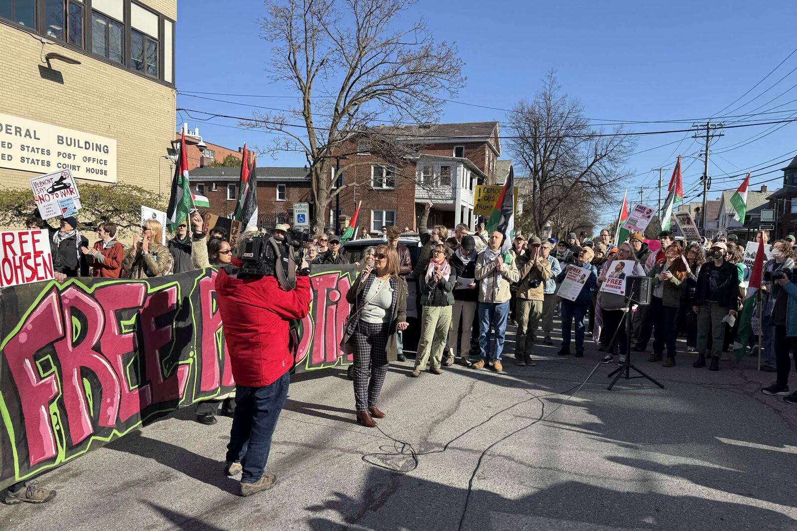 Protesters gather outside federal court ahead of a hearing for Mohsen Mahdawi, a Palestinian man arrested at a Vermont immigration office during an interview about finalizing his U.S. citizenship and a legal permanent resident who led protests against the war in Gaza at Columbia University, Wednesday, April 23, 2025 in Burlington, Vt. (AP Photo/Amanda Swinhart)