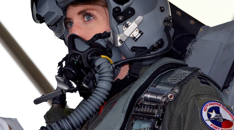 NAVAL AIR STATION FORT WORTH JOINT RESERVE BASE, Texas - Capt. Michelle Curran, 355th Fighter Squadron F-16 pilot, looks up during launch preparations on the flightline March 4, 2017. Curran was the first woman assigned to fly in the squadron and attributed her success to her parents, leadership and strong women in aviation past and present who’ve helped pave the way. U.S. Air Force photo/Staff Sgt. Samantha Mathison