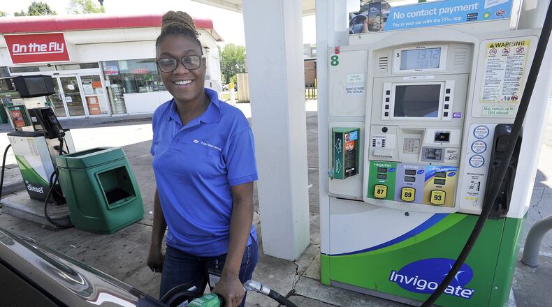Taylor Vaught fills her gas tank Monday at the BP Station on South Edwin C. Moses Blvd. MARSHALL GORBYSTAFF