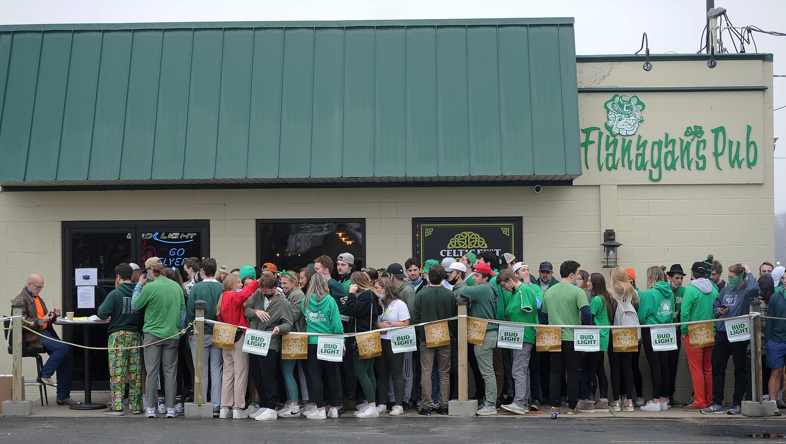 Patrons line up for St. Patrick's Day outside Flanagan's Pub early Wednesday morning, March 17, 2021. MARSHALL GORBY\STAFF