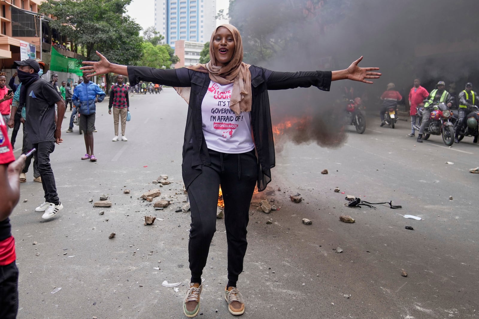 Kenyan activist Hanifa gestures during a demonstration over the death of blogger Albert Ojwang in police custody, in downtown Nairobi, Kenya, Tuesday, June 17, 2025. (AP Photo/Brian Inganga)