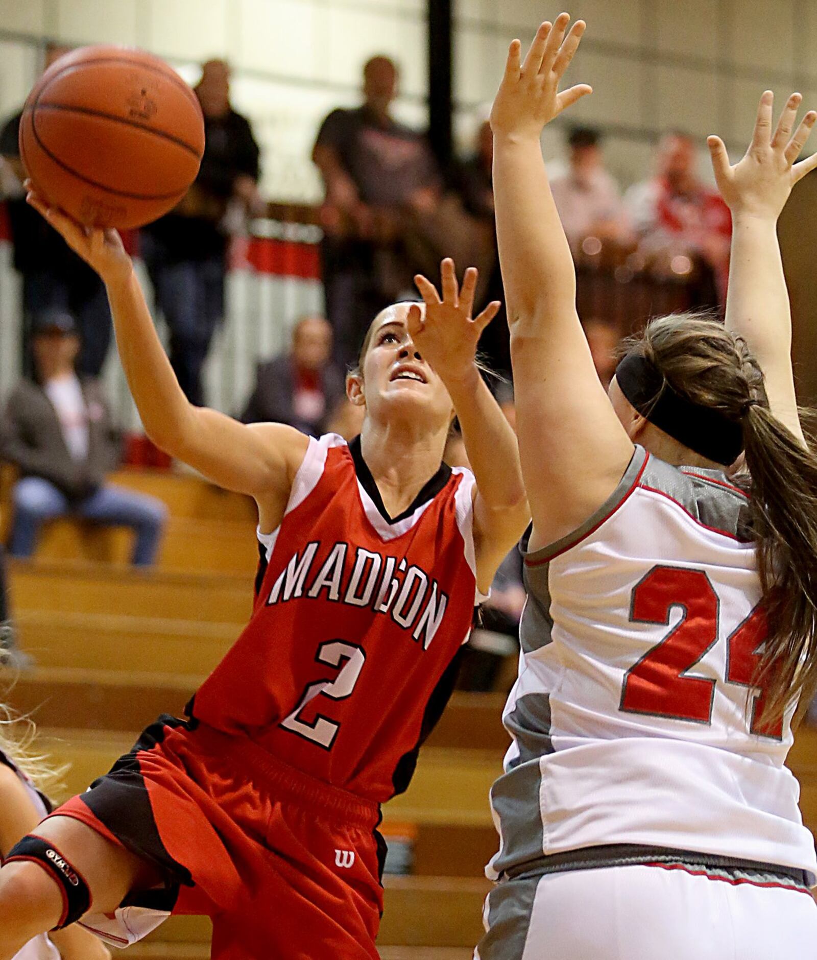 Madison’s Lillie Runnells puts up a shot while being covered by Carlisle’s Cassidy Whaley during their game at Carlisle on Saturday afternoon. CONTRIBUTED PHOTO BY E.L. HUBBARD