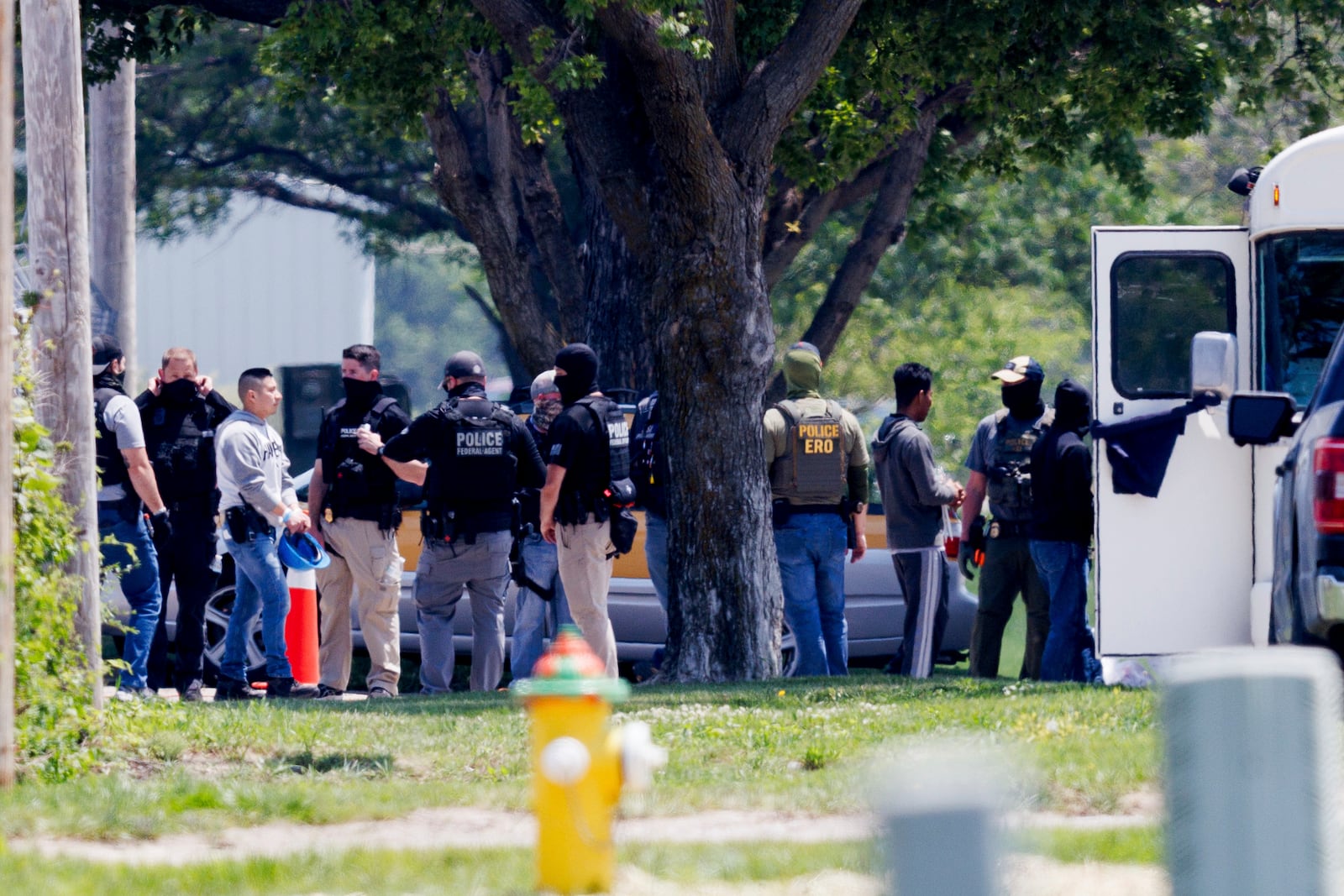 Federal agents are seen near Glenn Valley Foods in Omaha, Neb., Tuesday, June 10, 2025. (Nikos Frazier/Omaha World-Herald via AP)