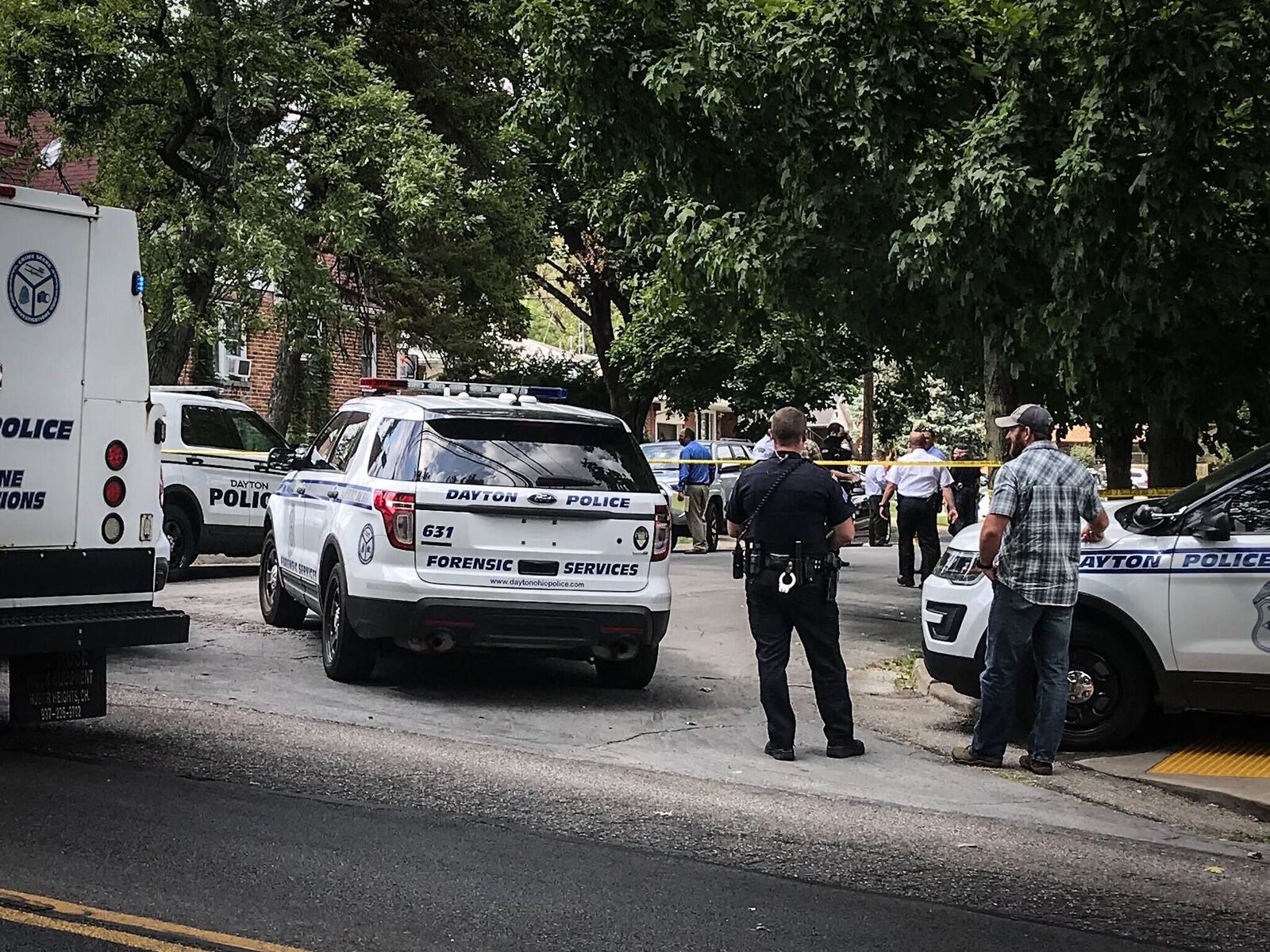 Police responded to the intersection of West Hillcrest Avenue and Mayfair Road in Dayton shortly before 2 p.m. Monday after a caller reported a man had been shot in a black car. JIM NOELKER/STAFF